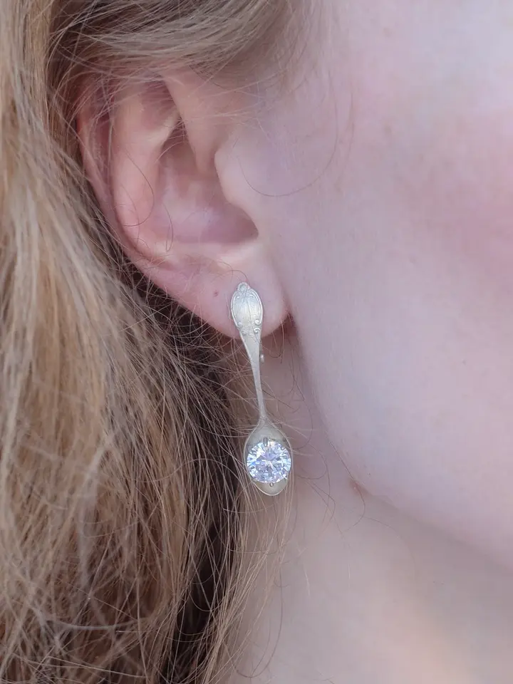 A close view of a dangling earring