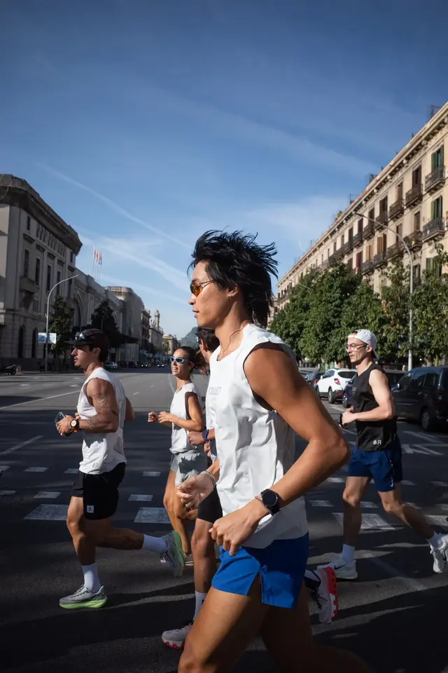 Runners moving along a city street